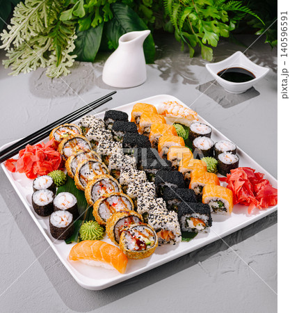 Japanese sushi rolls set with sauces and chopsticks Japanese sushi rolls set with sauces and chopsticks 140596591
