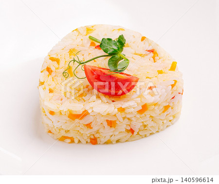 Rice pilaf with carrots and tomato garnish Rice pilaf with carrots and tomato garnish 140596614