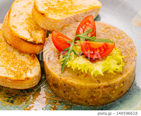 Eggplant caviar spread with toasted bread and cherry tomatoes Eggplant caviar spread with toasted bread and cherry tomatoes 140596618