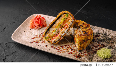 Fried sushi sandwich with salmon and avocado on plate Fried sushi sandwich with salmon and avocado on plate 140596627