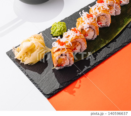 Sushi rolls with mango and roe on slate 140596637
