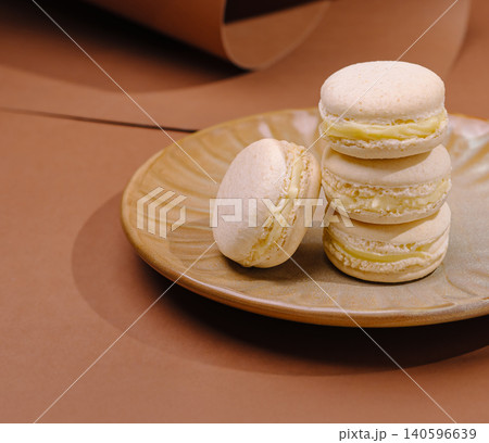 Vanilla bean macarons stacking on ceramic plate Vanilla bean macarons stacking on ceramic plate 140596639