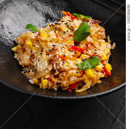 Vegetable fried rice with sesame seeds and cilantro Vegetable fried rice with sesame seeds and cilantro 140596686