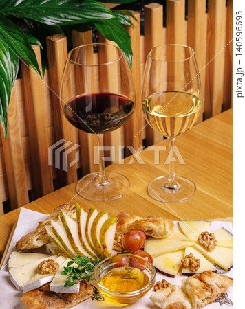 Red and white wine with cheese platter Red and white wine with cheese platter 140596693