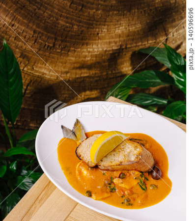 Seafood bouillabaisse stew with lemon and crusty bread Seafood bouillabaisse stew with lemon and crusty bread 140596696
