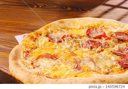 Pepperoni and chicken pizza with melted cheese Pepperoni and chicken pizza with melted cheese 140596724