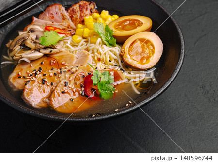 Ramen bowl with pork, noodles, corn, mushrooms, and soy eggs Ramen bowl with pork, noodles, corn, mushrooms, and soy eggs 140596744