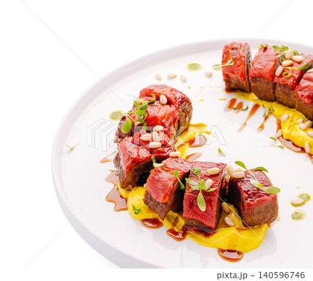 Gourmet roasted meat with red peppers and pine nuts Gourmet roasted meat with red peppers and pine nuts 140596746