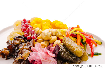 Assortment of pickled vegetables and mushrooms on plate 140596747