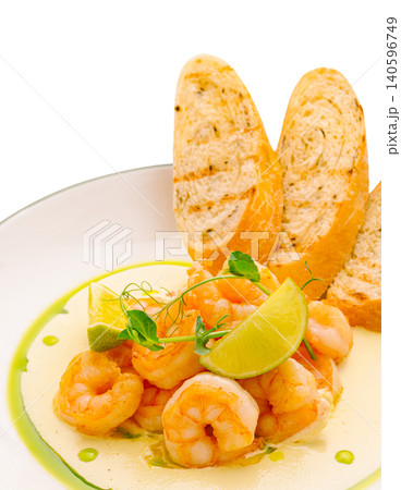 Grilled shrimp with bread slices and fresh lime Grilled shrimp with bread slices and fresh lime 140596749