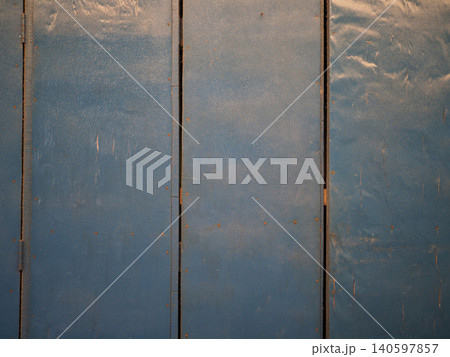 Blue metal panel background, worn industrial surface with rust detail Blue metal panel background, worn industrial surface with rust detail 140597857