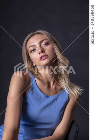 portrait of a young attractive woman on a dark background portrait of a young attractive woman on a dark background 140599469