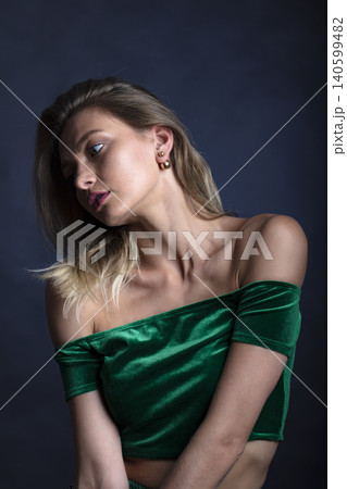 portrait of a young attractive woman on a dark background 140599482