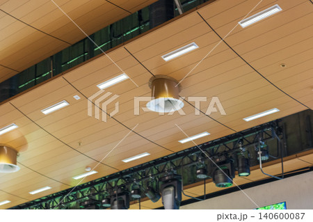 Professional stage lighting equipment hanging on a metal truss system in a modern theater Professional stage lighting equipment hanging on a metal truss system in a modern theater 140600087