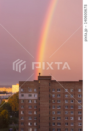Colorful rainbow over residential high rise building during golden hour Colorful rainbow over residential high rise building during golden hour 140600678