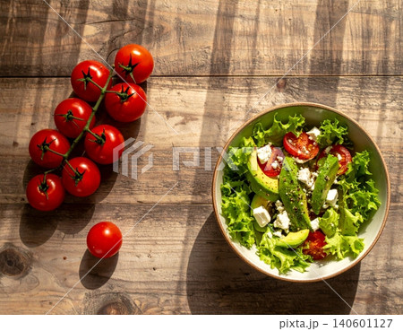 Salad with fresh vegetables - tomatoes, carrots, bell peppers and mixed green Salad with fresh vegetables - tomatoes, carrots, bell peppers and mixed green 140601127