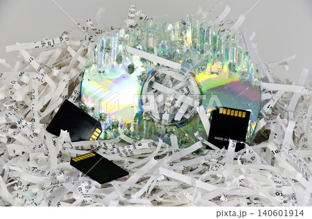 shredded papers and digital data storage 140601914
