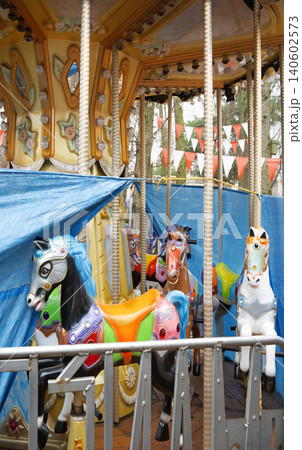 White ponies on an abandoned carousel White ponies on an abandoned carousel 140602573