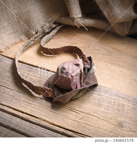 Old sling with a stone 140602579