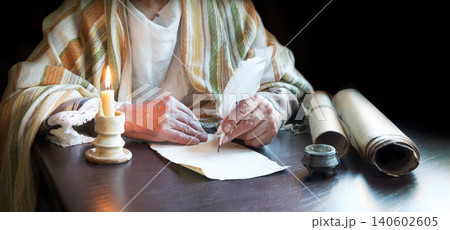 Male hand witn big quill Male hand witn big quill 140602605