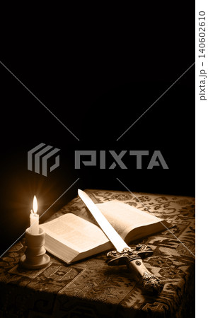 Old sword on the bible 140602610