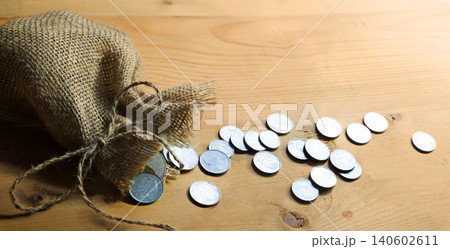 Silver coins in the bag 140602611