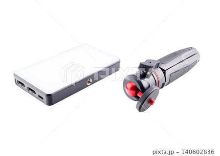 led rectangular panel and folded mini tripod on its side 140602836