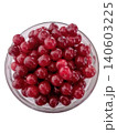 A bowl of red cherries sits on a white background The cherries are ripe and ready to eat 140603225