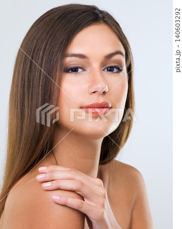 Woman, portrait and haircare in studio, growth and keratin treatment or brazilian on white background. Female person, closeup and luxury shampoo or conditioner for beauty, cosmetics and dermatology 140603292