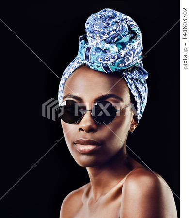 Portrait, fashion and sunglasses with African woman in studio isolated on black background for heritage. Aesthetic, face and tradition with confident young person in trendy headwear for style culture Portrait, fashion and sunglasses with African woman in studio isolated on black background for heritage. Aesthetic, face and tradition with confident young person in trendy headwear for style culture 140603302