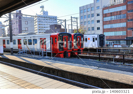 The red trains approached the platform to take up passengers at Mojiko Station. The red trains approached the platform to take up passengers at Mojiko Station. 140603321
