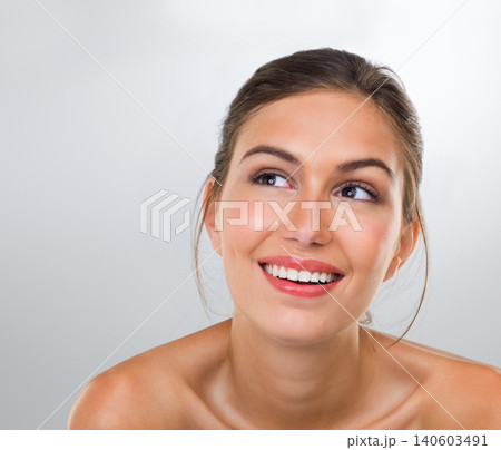 Woman, thinking and skincare with smile for beauty, dermatology and antiaging treatment shine isolated on white background. Reflection, cosmetic care and healthy skin glow with makeup in studio 140603491