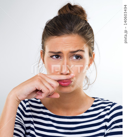Thinking, funny and finger moustache with woman, happy and person on a white studio background. Model, mockup space and girl with hand gesture and silly with expression and joke with comedy and goofy 140603494