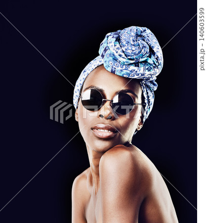 Portrait, beauty and fashion with African woman in studio isolated on black background for heritage. Culture, model and sunglasses with confident young person in trendy headwear for traditional style Portrait, beauty and fashion with African woman in studio isolated on black background for heritage. Culture, model and sunglasses with confident young person in trendy headwear for traditional style 140603599