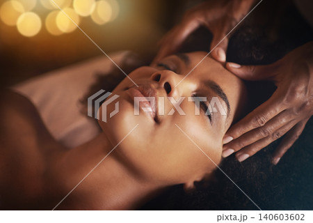 Black woman, hands and head massage with masseuse, beauty and bodycare at spa for stress relief and wellness. Closeup of face, treatment and healing for zen, self care and relax at luxury resort Black woman, hands and head massage with masseuse, beauty and bodycare at spa for stress relief and wellness. Closeup of face, treatment and healing for zen, self care and relax at luxury resort 140603602