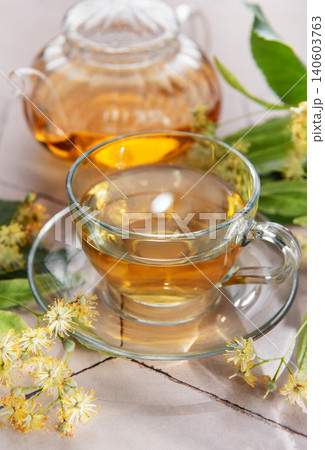 Linden tea cup and teapot brewing healthy drink Linden tea cup and teapot brewing healthy drink 140603763