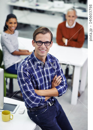 Portrait, businessman and smiling in office, technology and coworkers for web design. Professional, happy and employee for teamwork collaboration, creative and confident male person in workspace 140603798