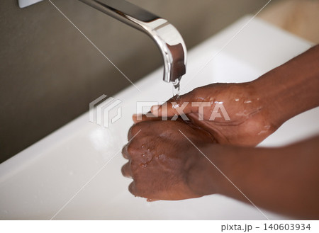 Sink, water and washing of hands for hygiene, bacteria and cleaning virus for healthcare. African person, self care and sanitary with bath with liquid in washbasin of bathroom for safety from germs Sink, water and washing of hands for hygiene, bacteria and cleaning virus for healthcare. African person, self care and sanitary with bath with liquid in washbasin of bathroom for safety from germs 140603934