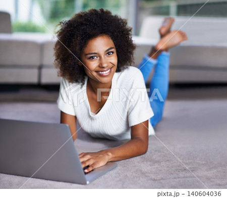 Carpet, laptop and portrait of woman on floor working on freelance creative project in living room. Happy, technology and African female designer typing on computer for research on rug in apartment. Carpet, laptop and portrait of woman on floor working on freelance creative project in living room. Happy, technology and African female designer typing on computer for research on rug in apartment. 140604036