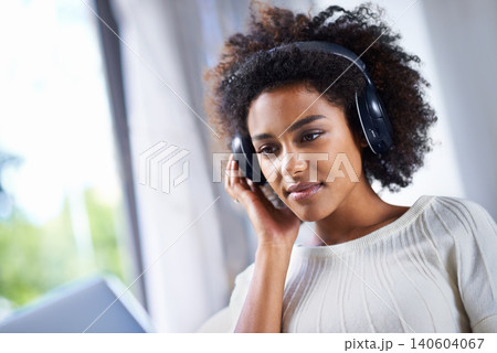 Headphones, woman and laptop with web, home and technology for video and music. African student, computer and internet for streaming, blog and email with connectivity and relax for wellness in house Headphones, woman and laptop with web, home and technology for video and music. African student, computer and internet for streaming, blog and email with connectivity and relax for wellness in house 140604067