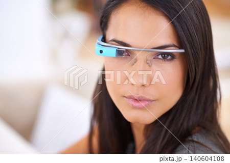 Woman, portrait and serious with smart glasses in home for virtual reality, high tech information and digital eyewear. VR, person and futuristic vision for communication, research and mockup in house Woman, portrait and serious with smart glasses in home for virtual reality, high tech information and digital eyewear. VR, person and futuristic vision for communication, research and mockup in house 140604108