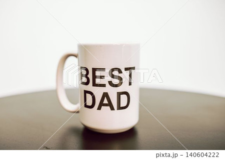 printed cup on a wooden table printed cup on a wooden table 140604222