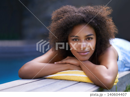 Deck, portrait and black woman relax at poolside for travel, break or chilling in a backyard on vacation. Face, smile and African female person at a wellness resort for resting on Thailand holiday Deck, portrait and black woman relax at poolside for travel, break or chilling in a backyard on vacation. Face, smile and African female person at a wellness resort for resting on Thailand holiday 140604407