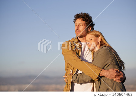 Outdoor, hug and couple with love, marriage or happiness with romance or honeymoon with joy. People, embrace or woman with man or date with anniversary or relationship with sunset or bonding together Outdoor, hug and couple with love, marriage or happiness with romance or honeymoon with joy. People, embrace or woman with man or date with anniversary or relationship with sunset or bonding together 140604462