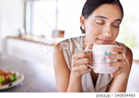 Woman, relax and smell coffee on kitchen or morning, enjoying and holding mug or cup. Female person, drinking tea or expresso for breakfast or energy at home, eyes closed and smile indoors or house Woman, relax and smell coffee on kitchen or morning, enjoying and holding mug or cup. Female person, drinking tea or expresso for breakfast or energy at home, eyes closed and smile indoors or house 140604465