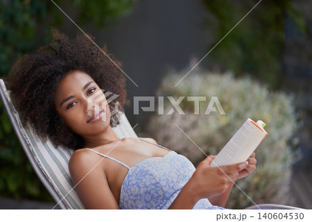 African, woman and book at resort for relax, peace and chill on vacation. Happy, natural portrait of black female person reading in nature, retreat and on holiday for confidence in summer in dress African, woman and book at resort for relax, peace and chill on vacation. Happy, natural portrait of black female person reading in nature, retreat and on holiday for confidence in summer in dress 140604530