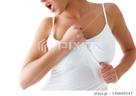 Fashion, woman and studio with passion in white background with frustration and upset with clothes. Female person, wear sleeveless and strong with body positivity, empowerment and confidence. Fashion, woman and studio with passion in white background with frustration and upset with clothes. Female person, wear sleeveless and strong with body positivity, empowerment and confidence. 140604547