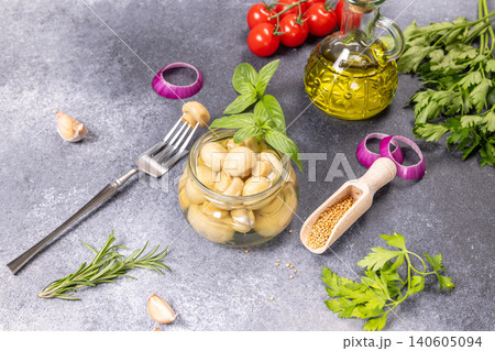 Pickled mushrooms with ingredients for preparing mediterranean appetizer Pickled mushrooms with ingredients for preparing mediterranean appetizer 140605094