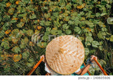 Top view conical hat on green water lily leaves lotus lake horizontal travel nature texture photo Top view conical hat on green water lily leaves lotus lake horizontal travel nature texture photo 140605606
