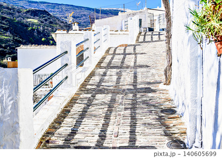Pampaneira, in the Alpujarra region of Granada, with its narrow, steep streets and water channels running through them Pampaneira, in the Alpujarra region of Granada, with its narrow, steep streets and water channels running through them 140605699